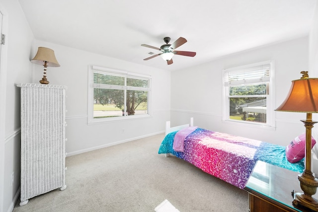 3796 Auburn Rd, Phenix City, AL 36870 - bedroom featuring multiple windows, carpet floors, and ceiling fan