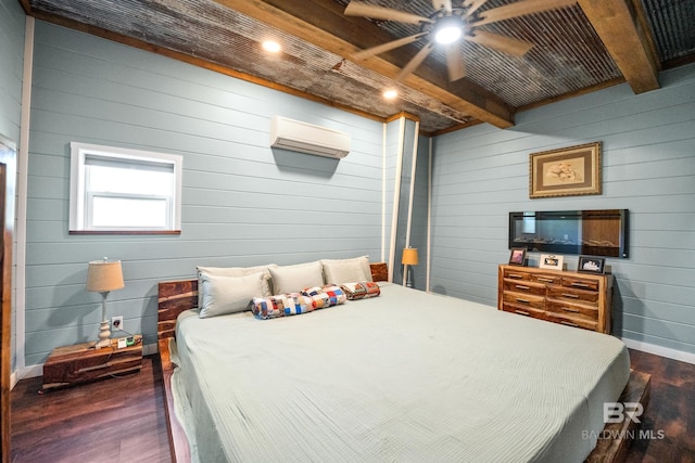 bedroom with a wall unit AC, a ceiling fan, dark wood-type flooring, and beamed ceiling