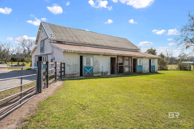 rear view of house featuring metal roof