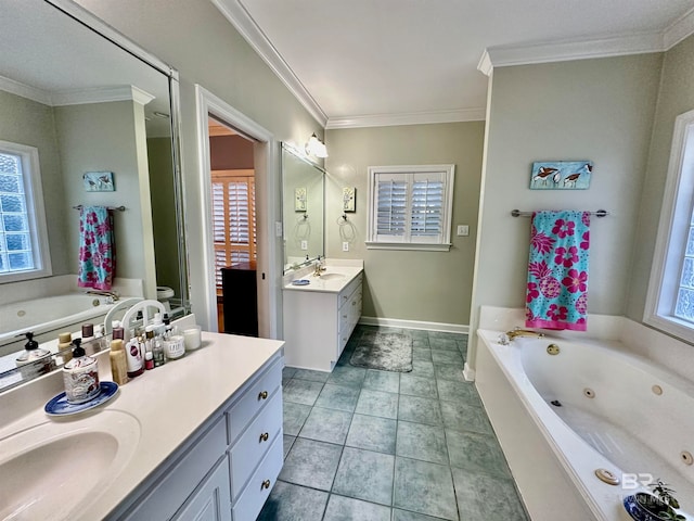 bathroom featuring a bathtub, ornamental molding, vanity, and a wealth of natural light