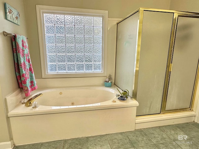 bathroom featuring tile patterned flooring, separate shower and tub, and plenty of natural light