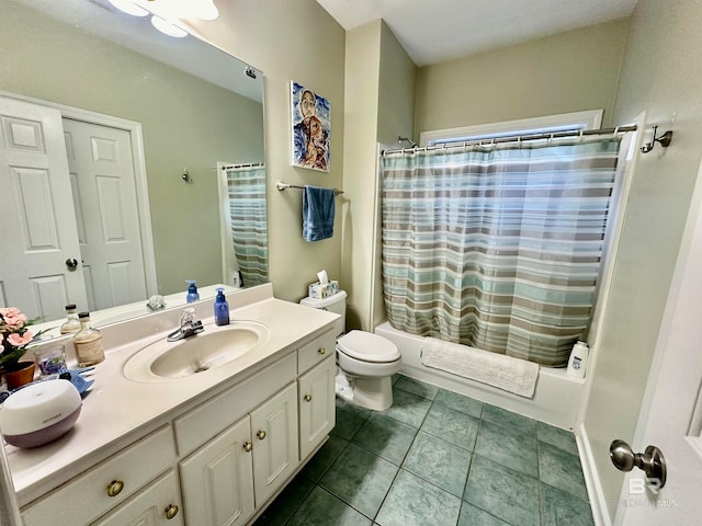 full bathroom featuring shower / bath combo, vanity, toilet, and tile patterned floors