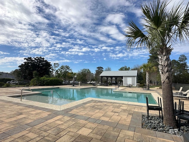 view of swimming pool with a patio area