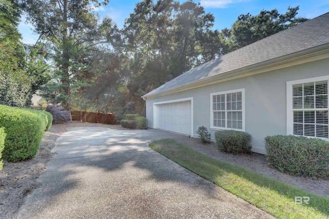 view of side of property with a garage