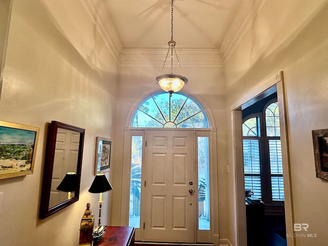 entryway featuring crown molding