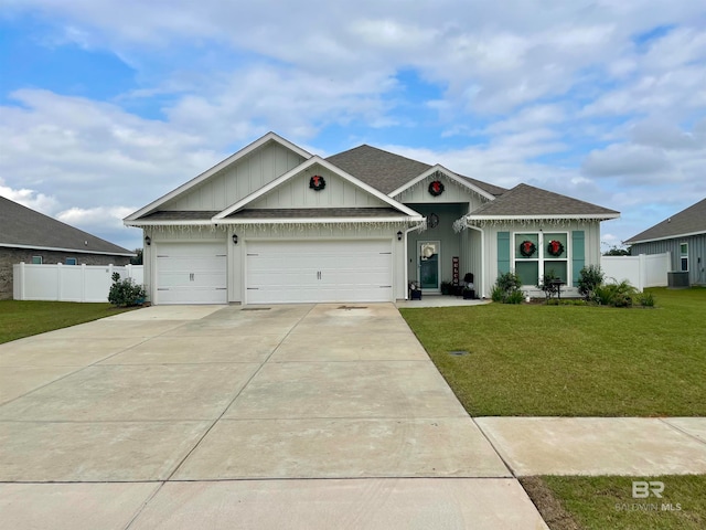 view of front facade featuring a front yard and a garage