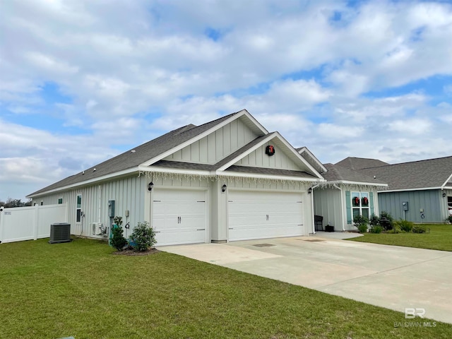 view of front of home with a front yard and a garage