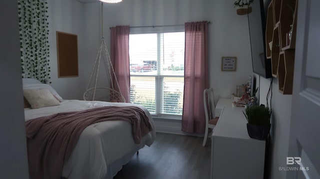 bedroom with hardwood / wood-style flooring