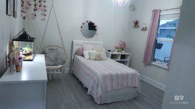 bedroom featuring dark hardwood / wood-style flooring