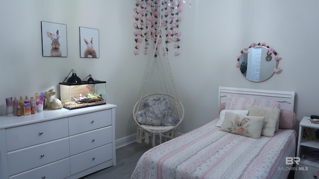 bedroom with dark hardwood / wood-style flooring