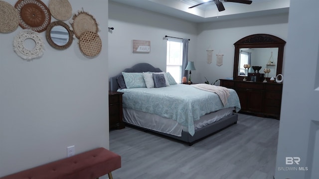 bedroom with hardwood / wood-style floors and ceiling fan