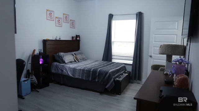 bedroom with light hardwood / wood-style flooring