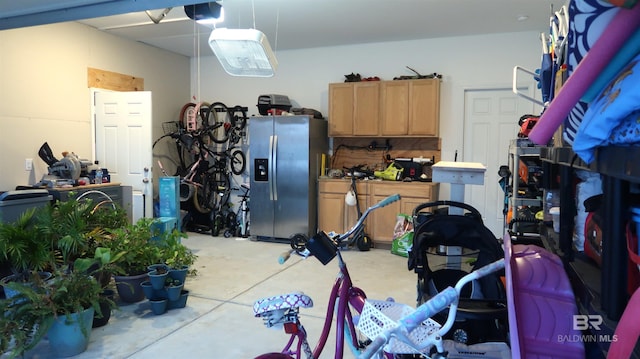 garage featuring stainless steel fridge