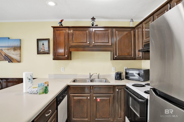 kitchen featuring dark brown cabinetry, sink, exhaust hood, and appliances with stainless steel finishes