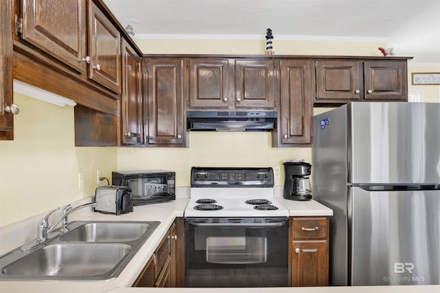 kitchen featuring stainless steel refrigerator, sink, dark brown cabinets, and range with electric stovetop