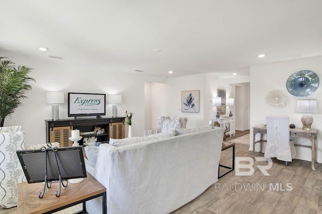 14304 State Highway 104, Silverhill, AL 36576 - living area featuring wood finished floors and recessed lighting