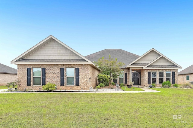 craftsman-style home with a front lawn