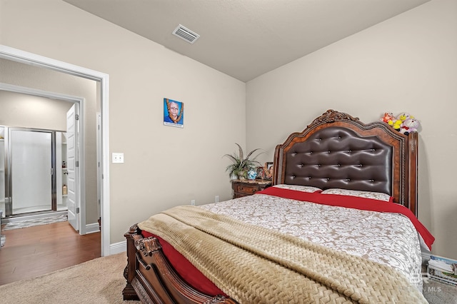 bedroom with wood-type flooring