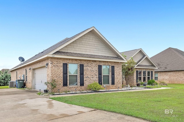 view of front of property with central air condition unit, a garage, and a front lawn