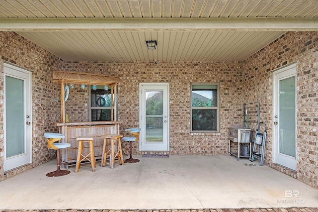 view of patio with exterior bar