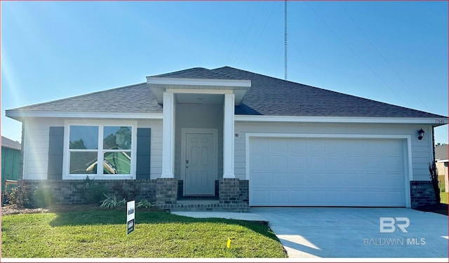 view of front of home with an attached garage, brick siding, a shingled roof, driveway, and a front lawn