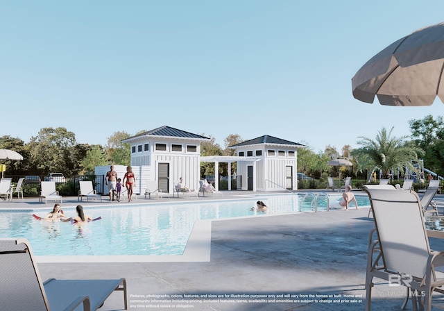 view of swimming pool featuring a patio and an outdoor structure