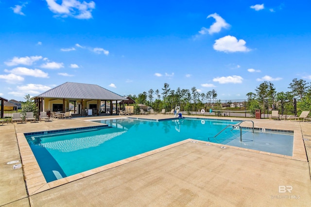 view of swimming pool with a patio area