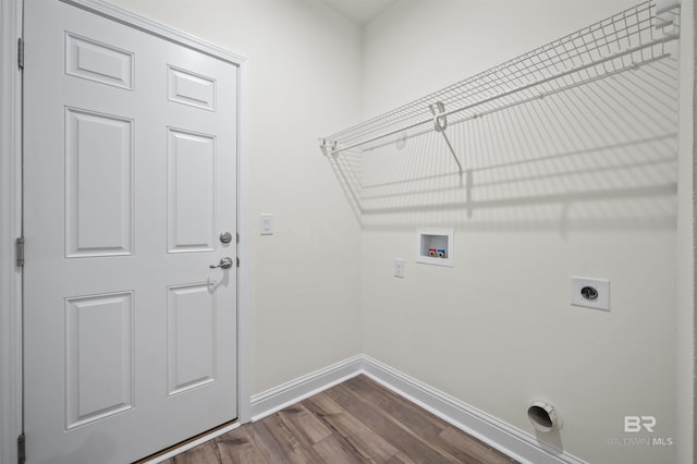 laundry room featuring dark wood-style flooring, baseboards, hookup for an electric dryer, hookup for a washing machine, and laundry area