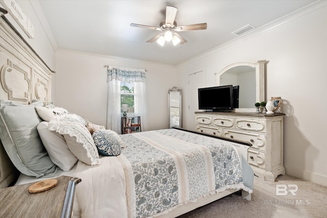 bedroom featuring carpet flooring, ceiling fan, and crown molding