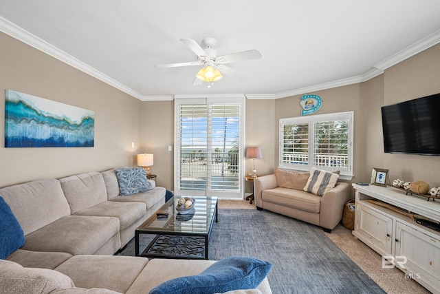 living area featuring light carpet, a ceiling fan, and crown molding