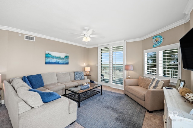 living area with ceiling fan, visible vents, light carpet, and ornamental molding