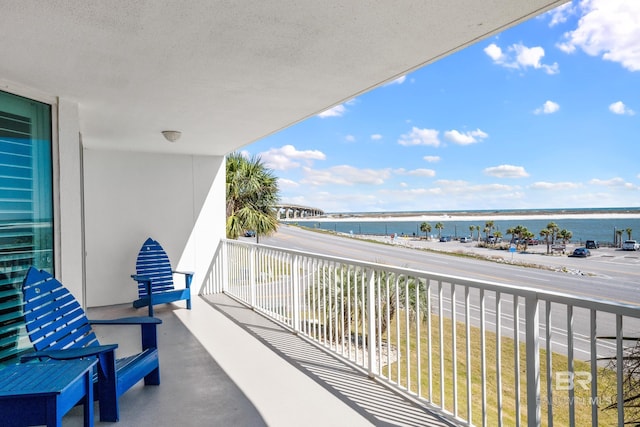 balcony featuring a water view