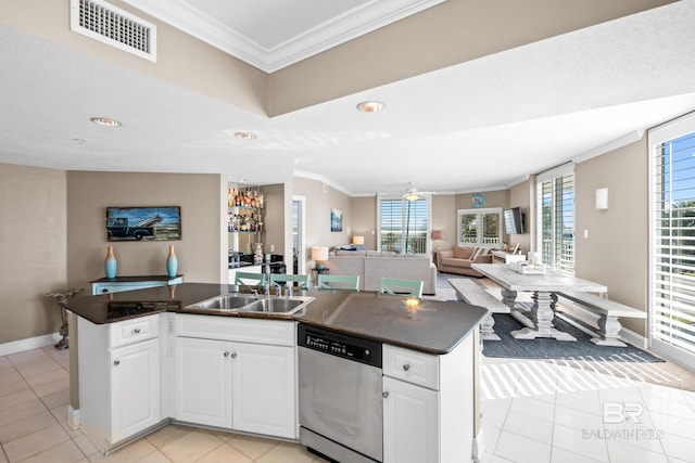 kitchen featuring visible vents, a sink, dark countertops, open floor plan, and dishwasher