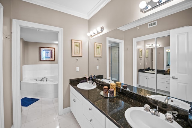 full bath with tile patterned floors, visible vents, a sink, crown molding, and a bath