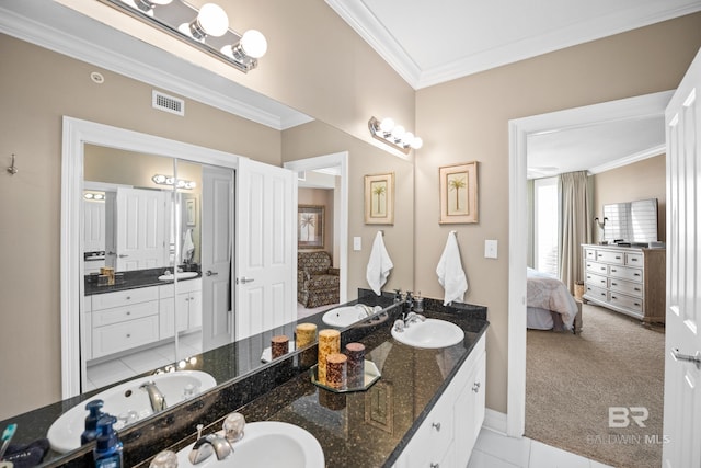 full bathroom with visible vents, connected bathroom, crown molding, double vanity, and a sink