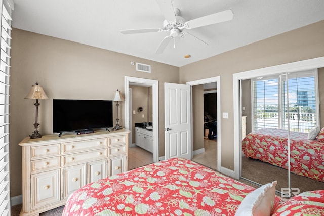 bedroom with visible vents, baseboards, light tile patterned flooring, and a ceiling fan