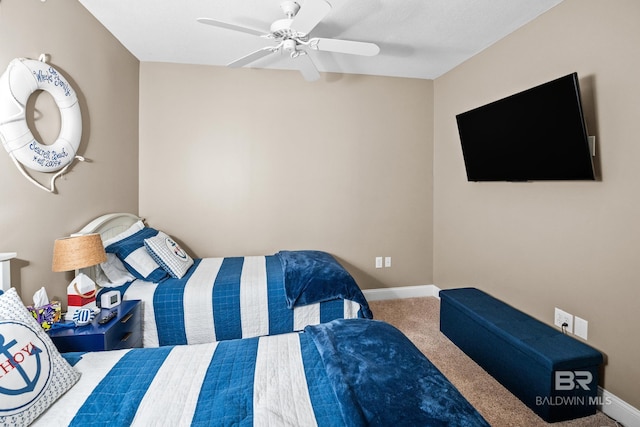 bedroom with a ceiling fan, baseboards, and carpet floors