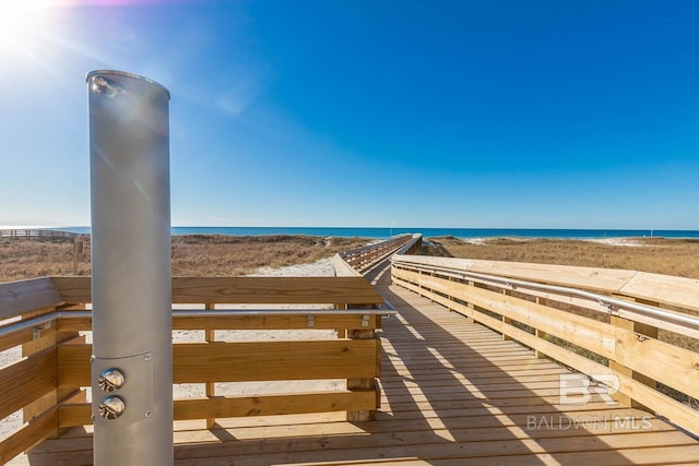 view of community with a view of the beach and a water view