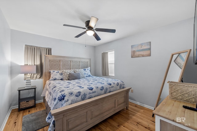 bedroom featuring ceiling fan and light hardwood / wood-style flooring