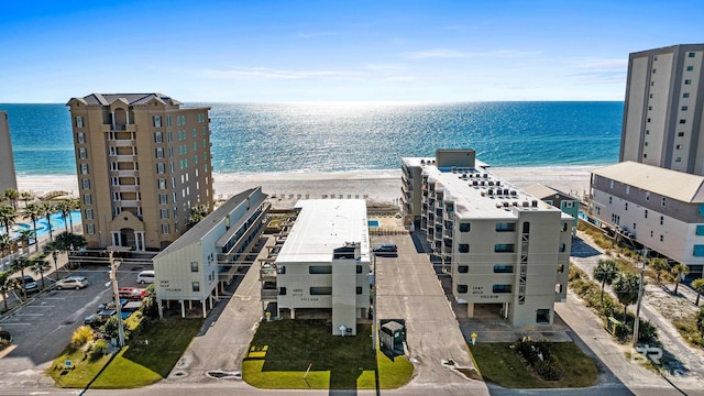 aerial view featuring a water view and a beach view