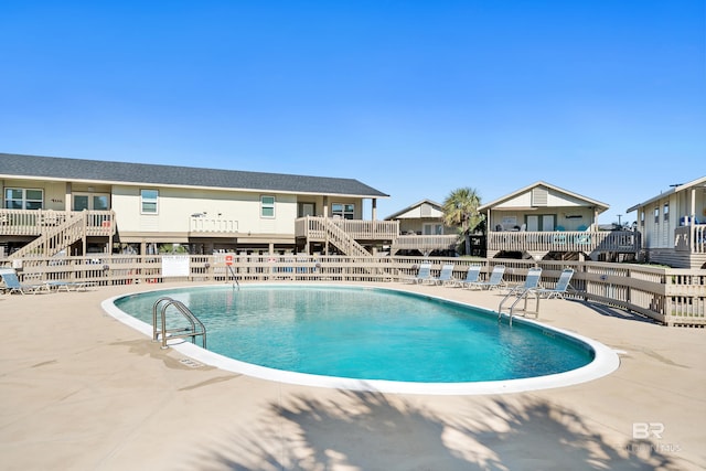 view of pool featuring a patio