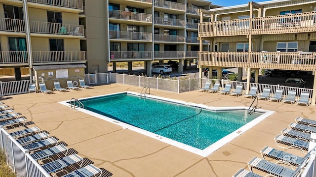 view of swimming pool featuring a patio