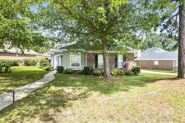 31304 Oakridge Ct, Spanish Fort, AL 36527 - ranch-style home featuring a front lawn, brick siding, and stucco siding