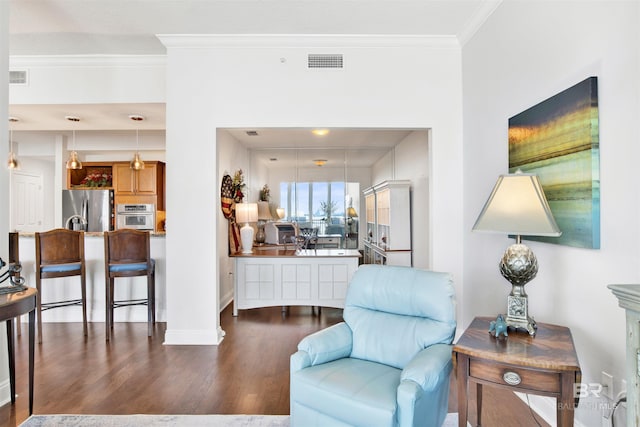 interior space featuring ornamental molding, visible vents, baseboards, and wood finished floors