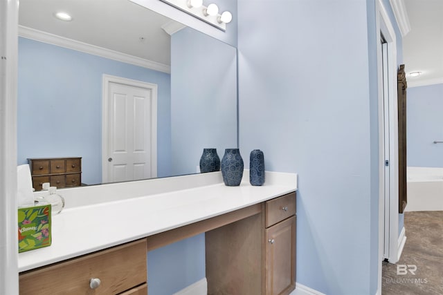 bathroom with baseboards, a washtub, vanity, and crown molding