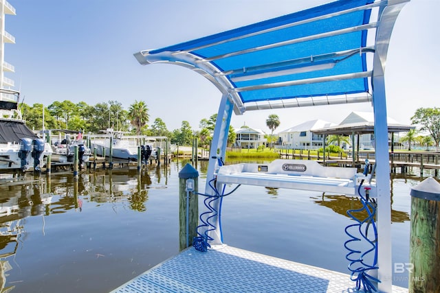 view of dock with a water view and boat lift