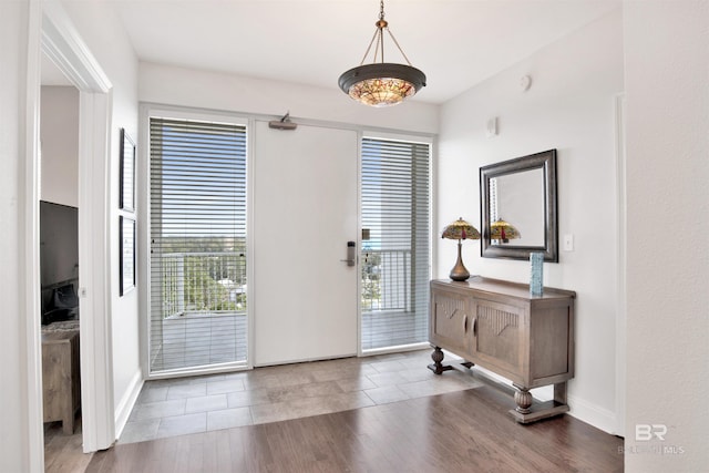 entrance foyer with wood finished floors and baseboards