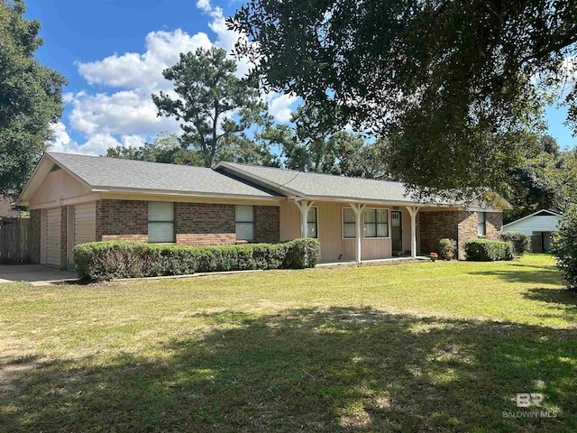 single story home featuring covered porch, a front yard, and a garage