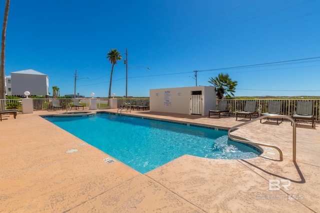 view of swimming pool featuring a patio area