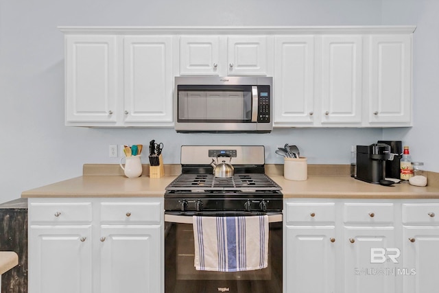 kitchen featuring light countertops, white cabinetry, and stainless steel appliances